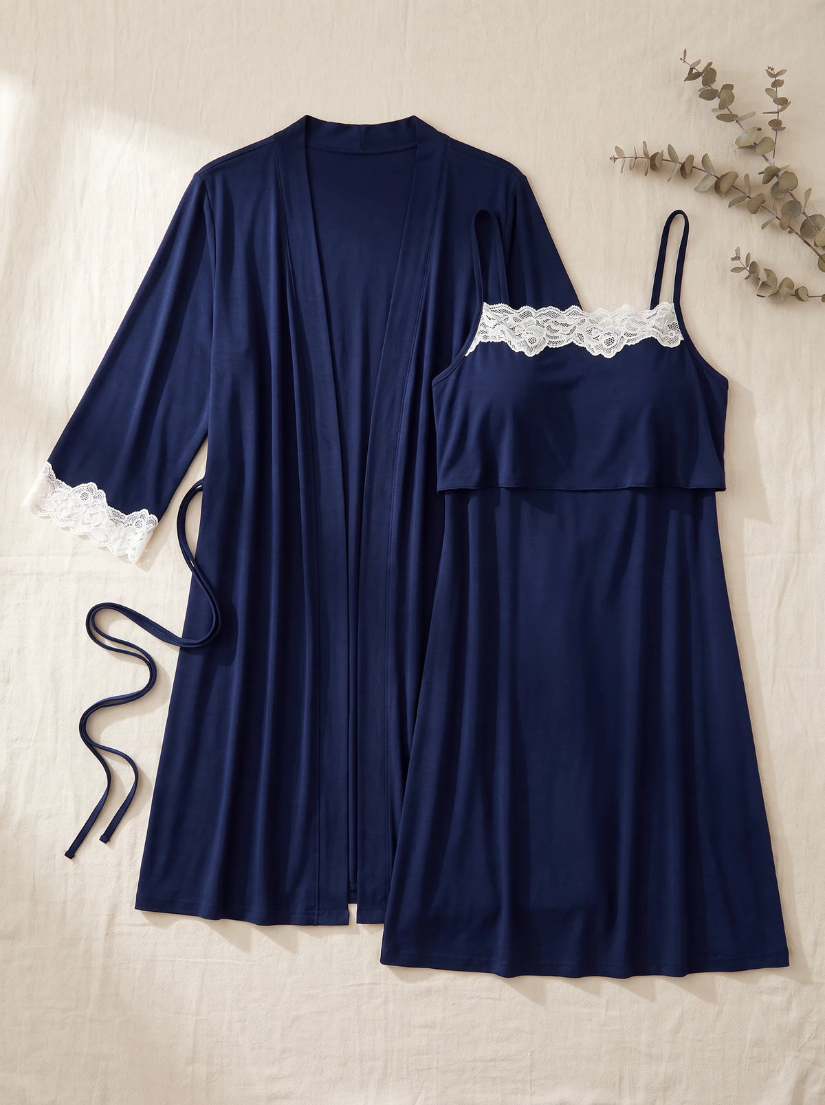 The navy robe and nursing nightgown laid flat side by side