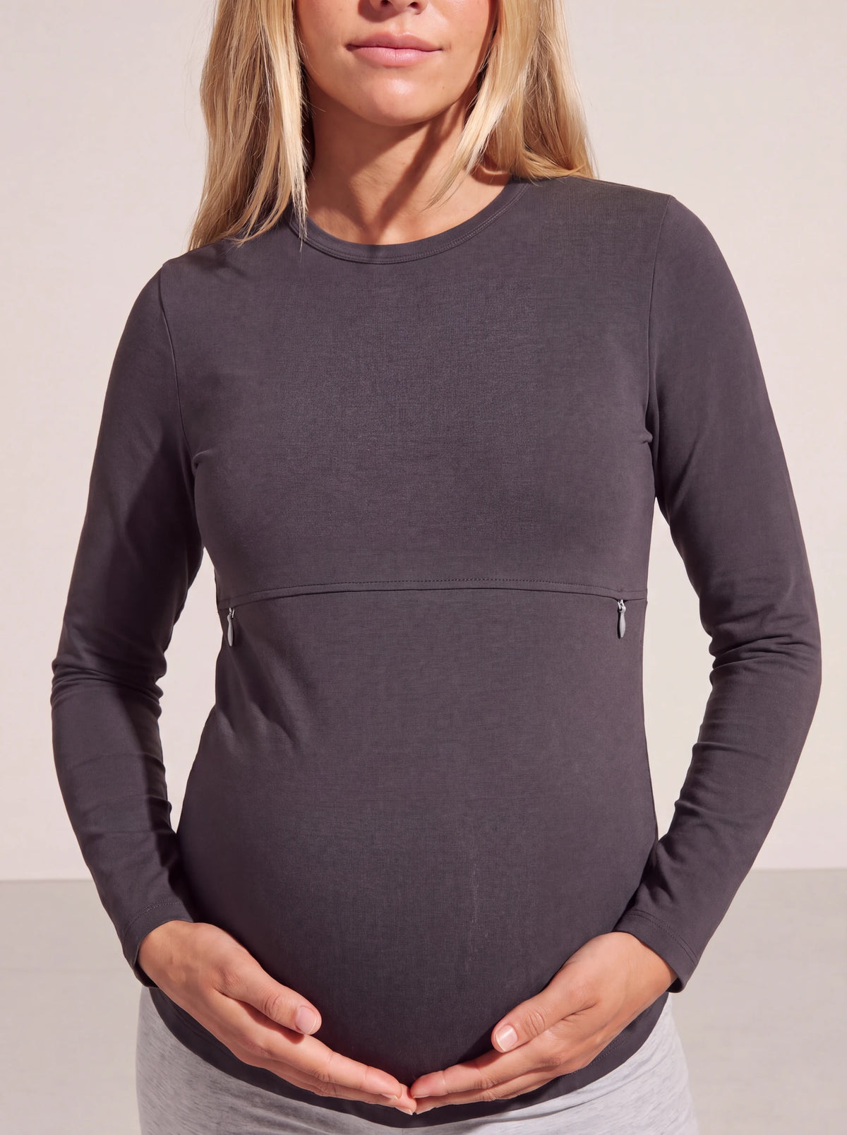 Soft stretch cotton dark gray nursing tee, hands resting on the bump
