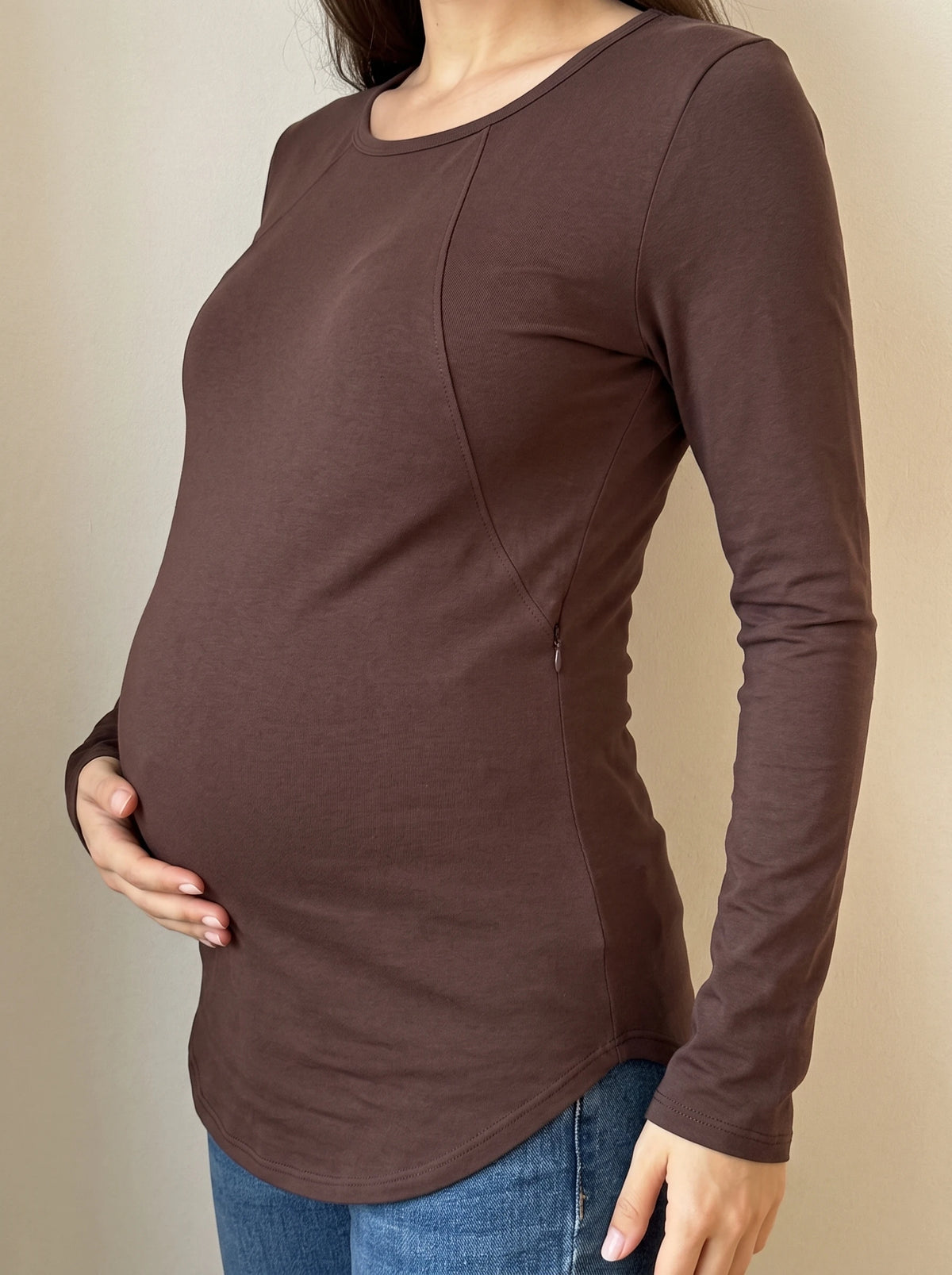 Close up of the curved chest seam that hides the nursing zipper
