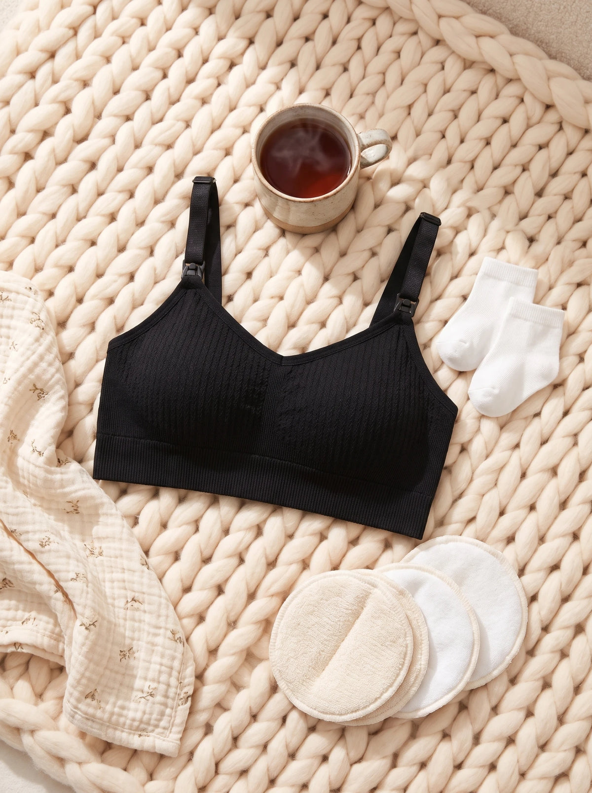 AURA Nursing Bra in Black with nursing pads and baby socks
