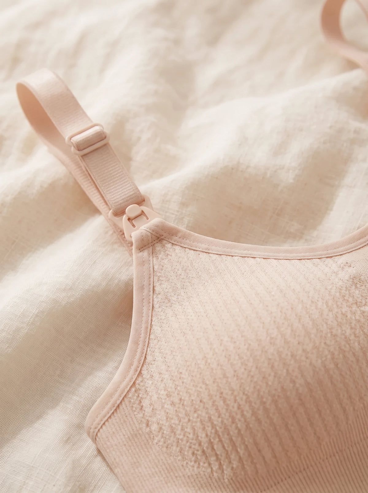 Close up of the nursing clip and adjustable strap