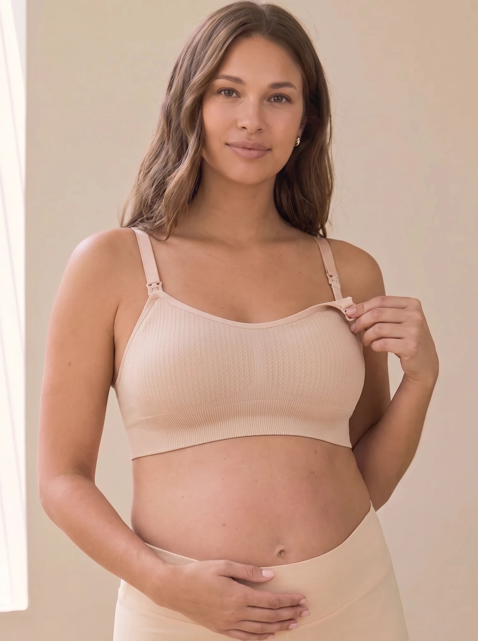 AURA nursing bra in Skin worn by a pregnant mom