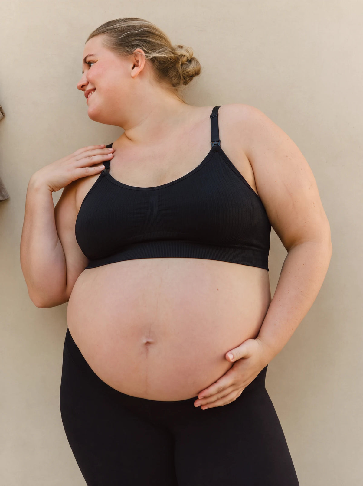 Aura Nursing Bra in Black on a pregnant mom