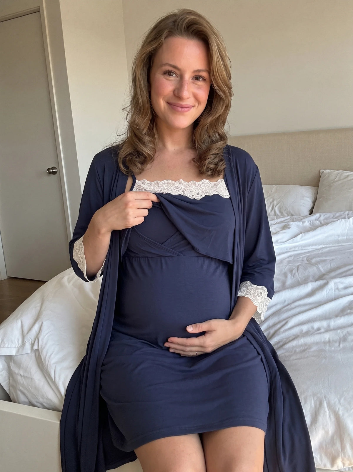 Mom lifting the top layer of the navy nightgown to nurse