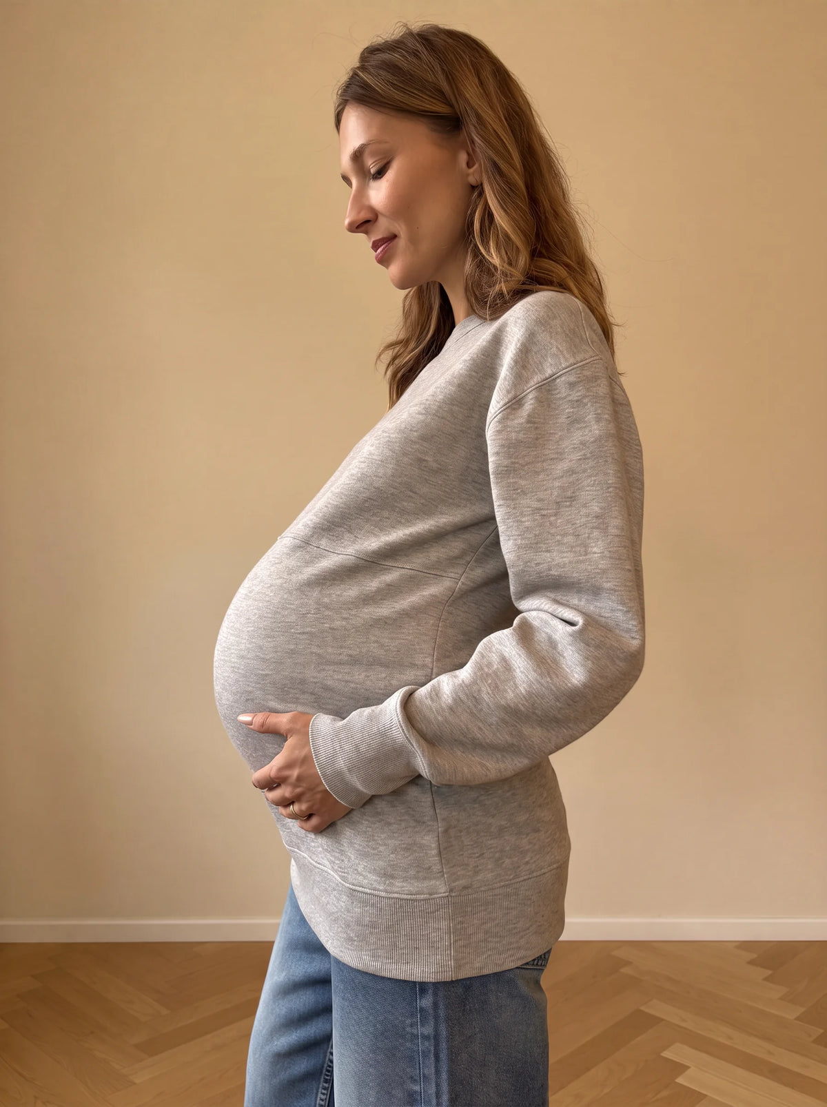 Gray nursing sweatshirt side view over the bump