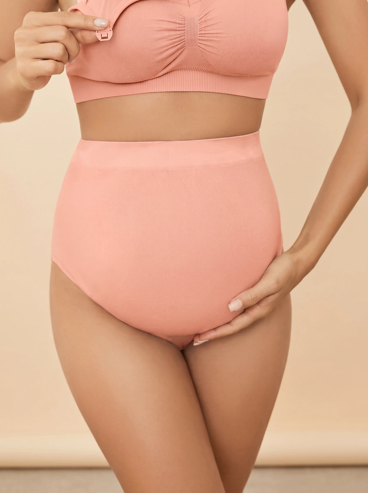 Pregnant mom wearing Belly Bliss over the bump maternity panties in pink